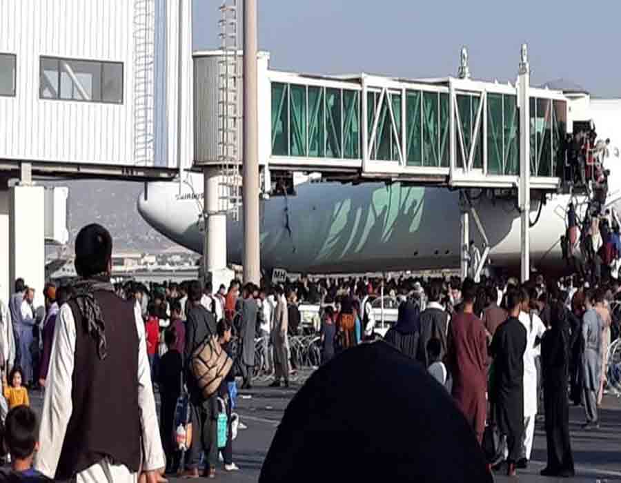 Chaos as people running around in Kabul airport to board flights
