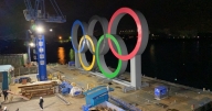 Olympics organisers may further reduce overseas delegates by 25,000